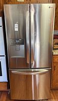 Front view of closed LG stainless steel French door refrigerator
