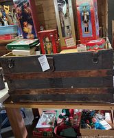 Wooden trunk with metal hardware and rustic look, approximately 41 inches in length, displayed closed showing front and side details.