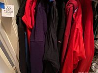 Group shot of jackets on rack including leather, Patagonia windbreaker, Polo Sport fleece
