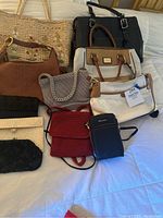 Overview of 10 assorted bags including totes, purses, crossbody bags and clutches, showing variety of colors and styles.