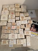 Overview of all boxed figurines arranged on floor