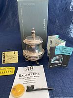 Full lot display with lighter, original box, manuals, flints, and brush.