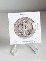 Obverse of 1942 Walking Liberty half dollar in holder on stand