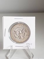 Reverse of 1967 Kennedy Half Dollar in holder