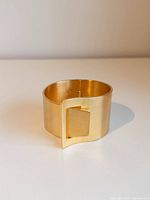 Cuff bracelet front showing asymmetrical opening and brushed finish