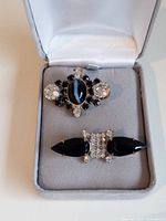 Both rhinestone buttons in gray box, open lid