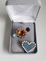 Buttons in open jewelry box showing overall appearance