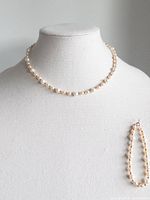 Necklace displayed on bust with bracelet alongside