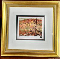 Full view of framed limited edition print "Autumn Algoma" showing ornate gold frame and double matting with accent colors, print centered.