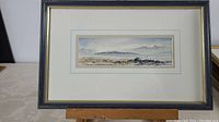 Framed watercolour painting showing overall artwork and frame.