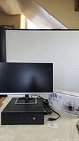 Overview of desktop, monitor, mount box and limited cables
