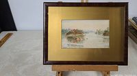 Full view of the framed watercolour painting showing the landscape scene and original frame.
