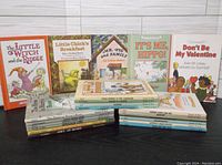Front-facing photo of 9 children's books showing title and cover illustration details, used condition from 1970s-1980s.