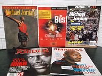 Five Michael Jordan magazines as a group laid out on a white surface showing front covers.
