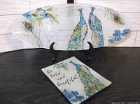 Large oval glass plate with peacock watercolor design on stand