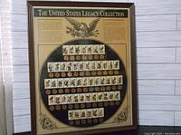 Full view of the framed United States Legacy Collection with stamps and custom stamped pennies in rows beneath each stamp, with informative text above.