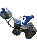 Side view of Snow Joe 24 inch cordless 2-stage snow blower showing wheels, chute, motor area, and handle.