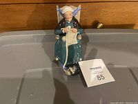 Front view of Royal Doulton Twilight figurine featuring elderly woman knitting.