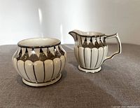 Photo of cream jug and sugar bowl showing the overall design and condition of the antique cream and sugar set