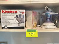 Photo showing KitchenAid 3-quart bowl and combi-whip packaging box and a different appliance to the right.