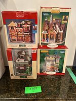 Four boxed Lemax porcelain village collection buildings including Apothecary Shoppe, Winter House, Creek Side Cabin, and Pool Hall.