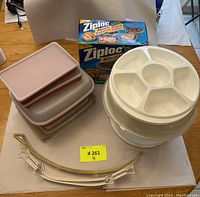 Overview of all items including Tupperware containers, serving tray, rack holders, and Ziploc box in original packaging.
