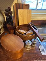 Overall view of carving knife block, cutting boards, salad bowl, shaker box and salt & pepper shakers