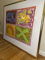 Framed print leaning against wall, side‐angle view