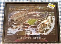Full view of the framed aerial photo of Gillette Stadium with the stadium and surrounding areas visible.