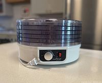 Front view of NutriChef Food Dehydrator with all trays stacked and plugged in, showing overall shape and build.