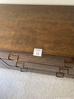 Top-down view of dresser top surface showing walnut grain and finish
