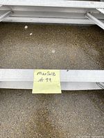 Close-up of ladder markings and size note.