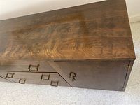 Close-up of top surface showing walnut wood grain and finish