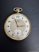 Front view of the watch showing dial, hands and case condition