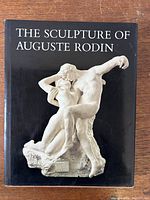 Front cover of the book showing the title and a sculpture image on a black background.