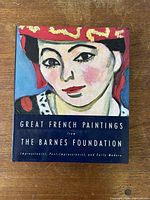 Front cover of the hardcover art book showing a painted portrait in bright colors and the title referencing French paintings from the Barnes Foundation.
