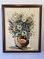 Full view of vintage oil painting framed, showing flowers in vase.