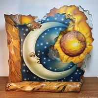 Front view of lamp showing painted moon and sun panels in wood frame