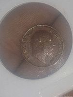 Obverse side of the 1907 India 1/12 Anna copper coin showing King Edward VII's portrait.