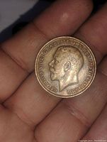 Obverse side showing King George V profile and inscription.