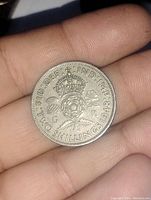 Reverse side showing crowned rose, thistle, shamrock, and text.