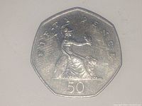 Close-up photo of the front side of the 50 Pence England coin featuring Britannia design.