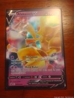 Front view of the Alakazam V Pokemon card showing holo foil and artwork details.