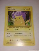 Front view of Pikachu Pokemon card showing artwork, HP, moves and stats