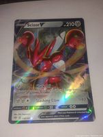 Full image of a Scizor V full art holo foil Pokemon card with visible holographic effects and text