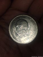 Obverse side of the coin showing the profile of Sir Winston Churchill with his name across the edge.
