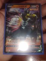 Close-up of one Urshifu V Full Art Single Strike Pokémon card with holographic foil.