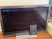Front view of Sony Bravia television showing screen and bezel, TV appears in good condition.