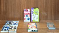 Full lot showing Bicycle playing cards, Old Maid, Solitaire decks, and baseball collector cards.