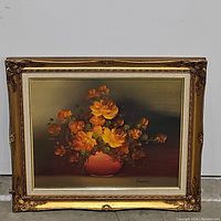 Front view of the oil painting showing floral arrangement and gold frame.